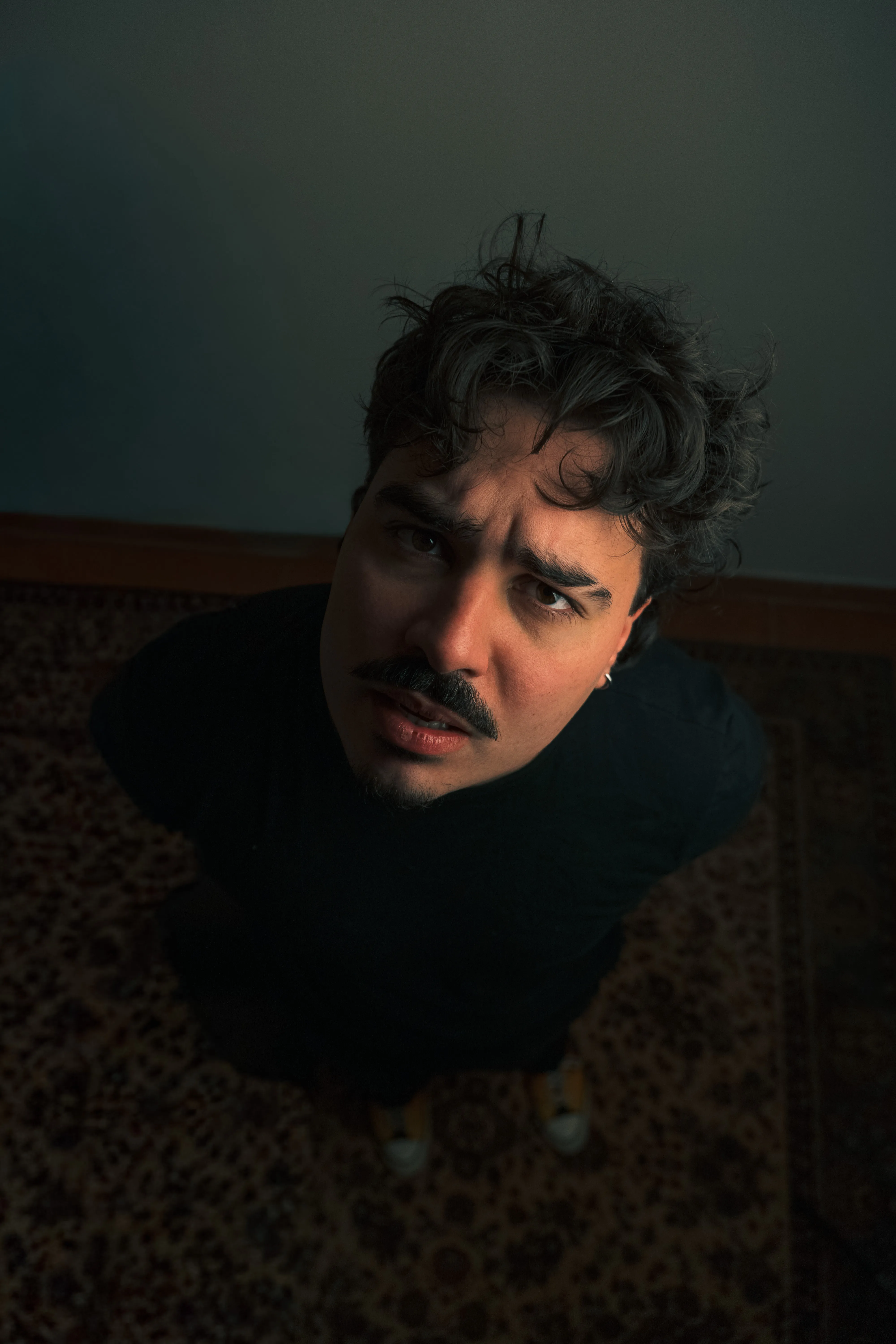 Daniel, three-quarter portrait, strong shadow